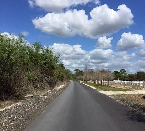As you continue north on Huffmaster the fenced property on the right is the neighboring estate and has a beautiful large home and other outbuildings.