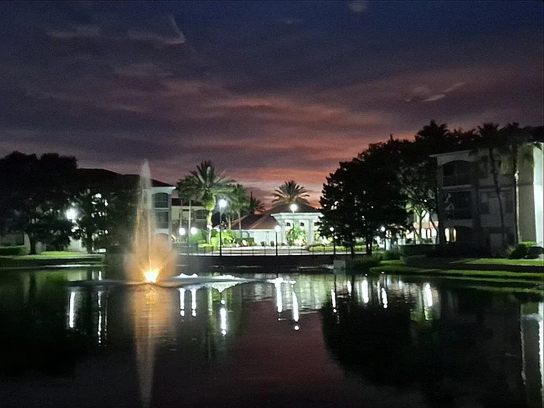 Night time view lake/clubhouse from rear of unit