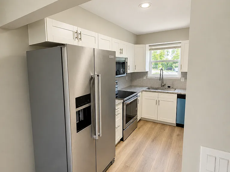 6932 NW Chapel Woods Ln — Photo 5