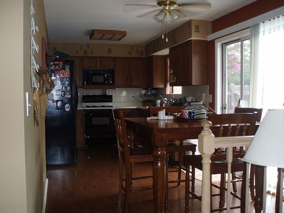 Kitchen with sliding door to deck and in ground pool.  Newer appliances!