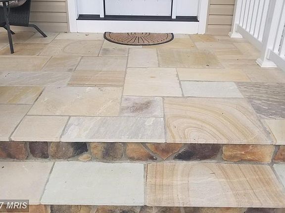 Gorgeous stone floor on front covered porch