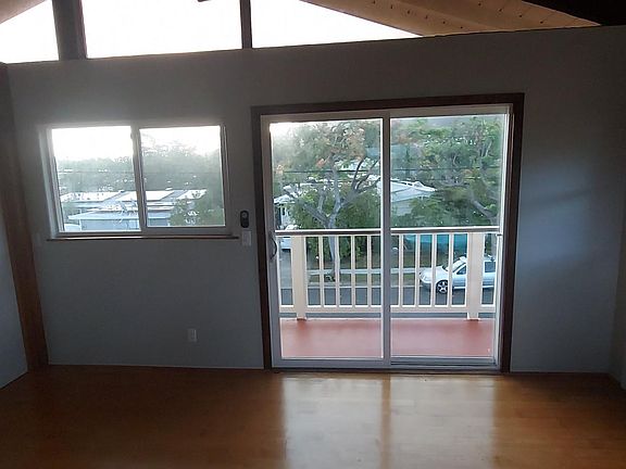 View of the rest of the living space and balcony from kitchen.