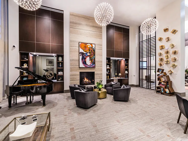 Grand salon with piano and fireplace for refined gatherings.