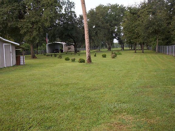 west from behind house