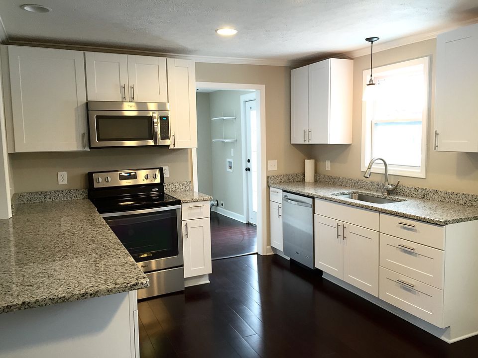 View of kitchen into mudroom/laundry. House includes a washe