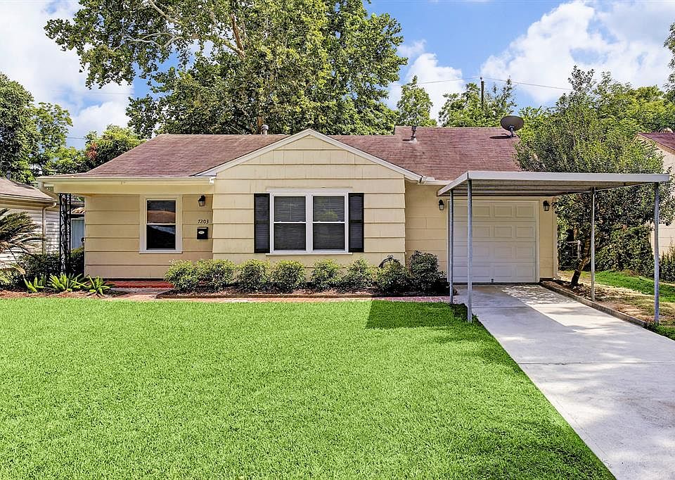 WHAT A DOLL HOUSE AND SO TASTEFULLY RENOVATED TO BOOT IN 2013! THE HOME FEATURES A ONE CAR GARAGE & A CARPORT! THIS CONCRETE DRIVEWAY WAS JUST INSTALLED IN JULY OF 2018!