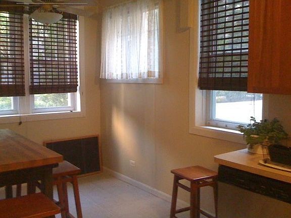 Dining area with view of fenced courtyard