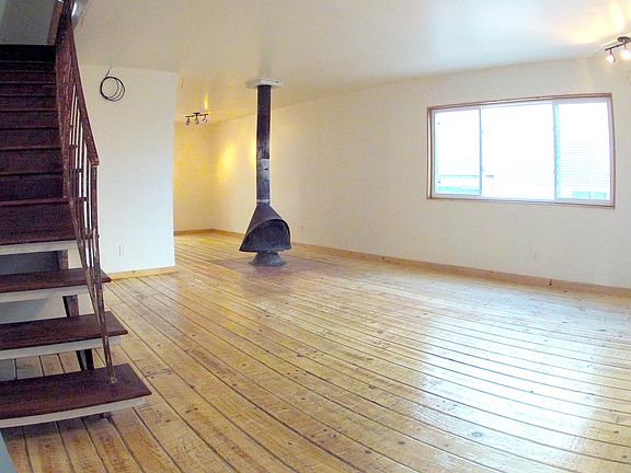 Living Room with fireplace and natural hardwood floors.