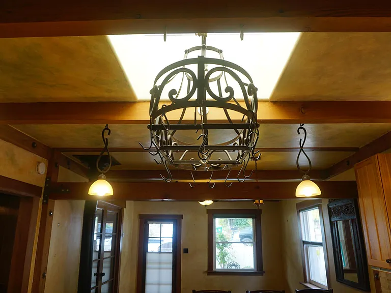 Skykight over Custom Kitchen Island with rack for cookware