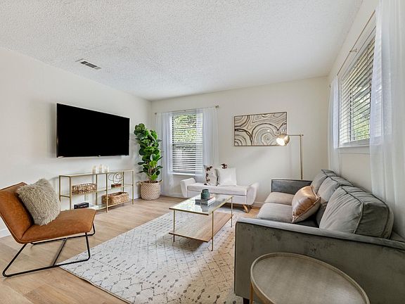 Walk into a natural light living room, perfect for relaxing!