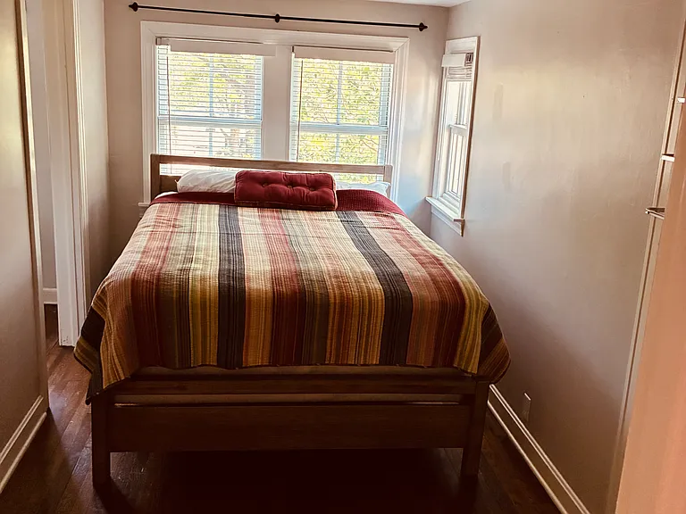 Bedroom with a queen bed and mattress