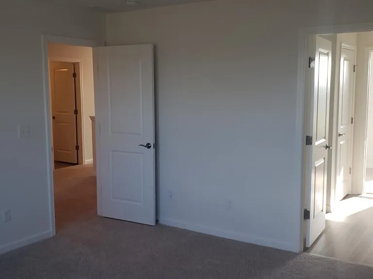 Owner's suite looking into bathroom and out into hallway