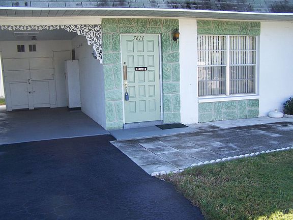 Front with Carport & Courtyard