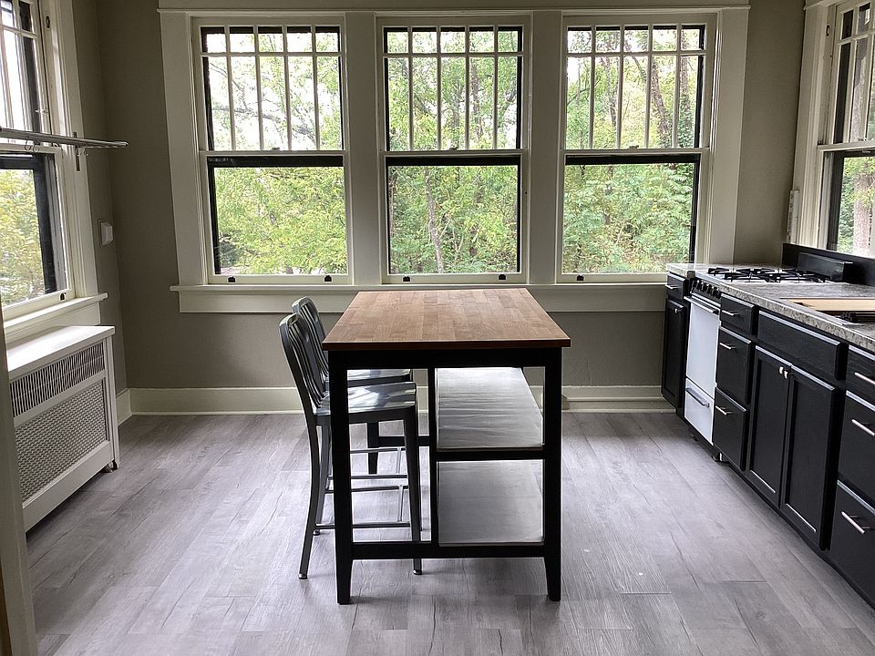 Eat- in kitchen with island. A lot of natural light with 7 windows.