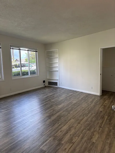Another view of spacious sunny front room