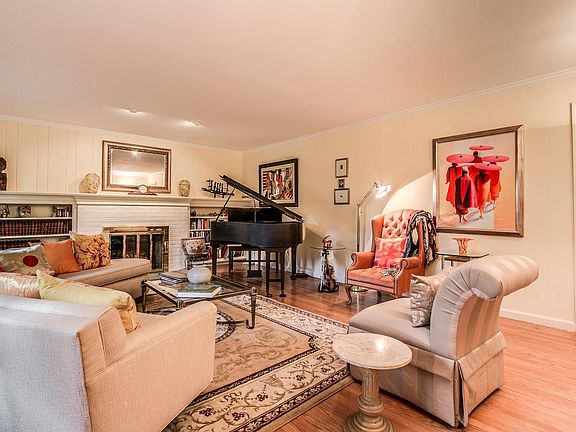 Large living rm: brick fireplace & recessed lights