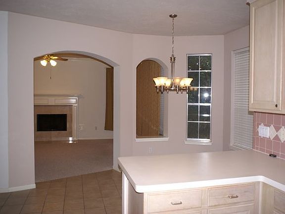 Looking from kitchen, across breakfast into family room