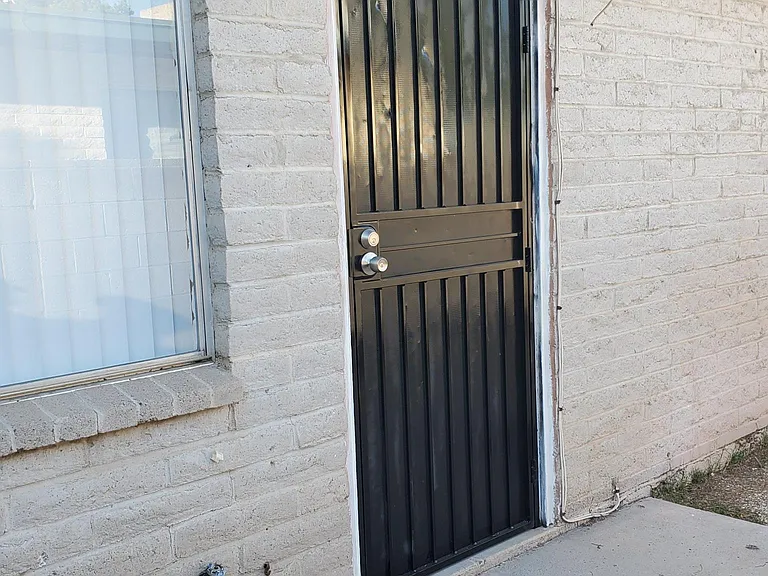 Entrance with securoty Door
Fenced Patio and yard.