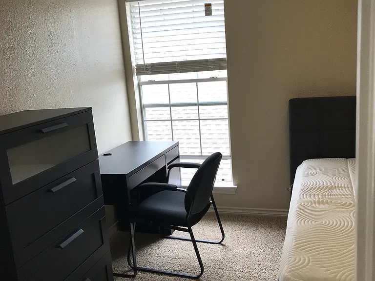 Secondary Bedroom #2, furnished with full size bed, tall dresser, desk, chair, & nightstand. Walk in closet. Private space for occupant of secondary bedroom #2.