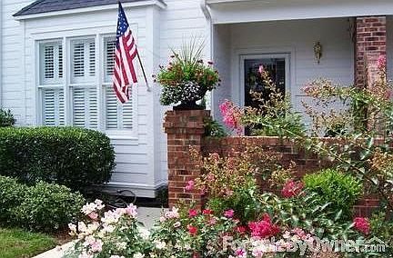 Lovely Floral Spectacle : Perennial roses and crepe myrtle enhance the entrance.