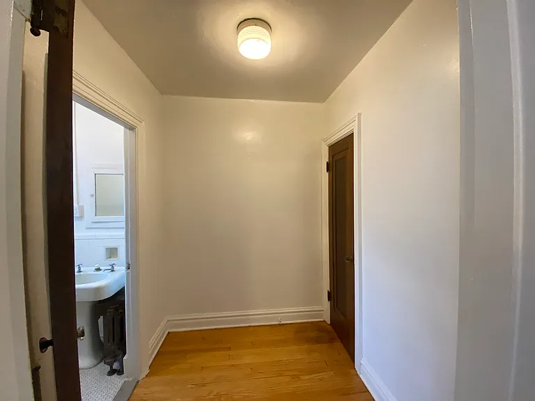 Connected to the main living space, the dressing room contributes to the apartment's airy, open-concept design while keeping the restroom separated. Also where you will find the third closet.