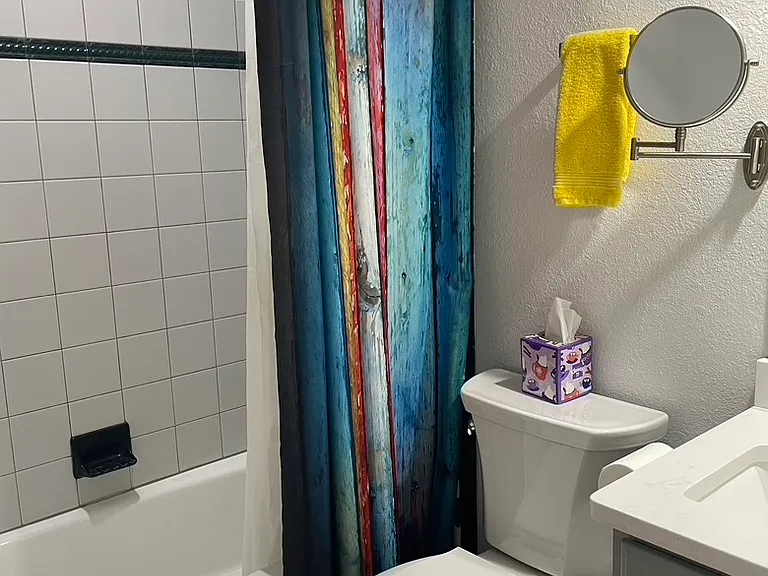 Guest bathroom, en suite, with shower and tub.