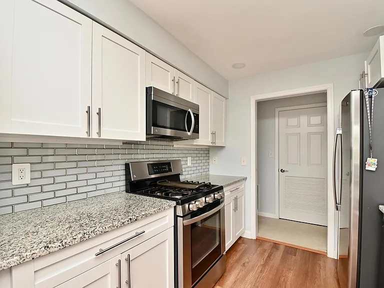 Kitchen with lots of work space - stainless steel appliances.