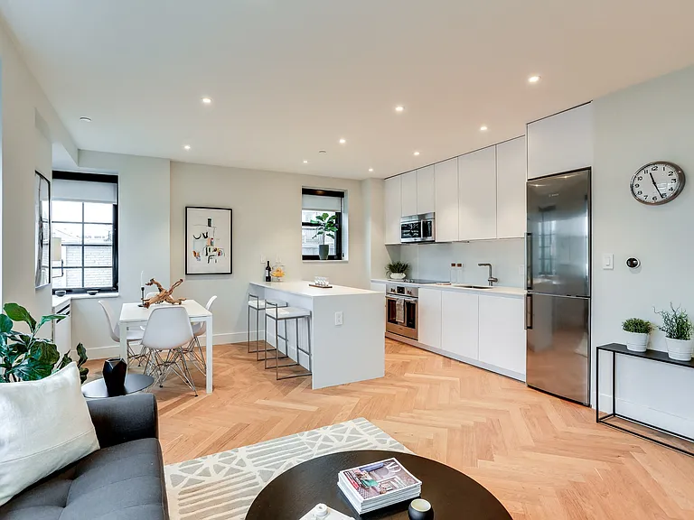Open concept living and dining rooms with brand new hardwood flooring