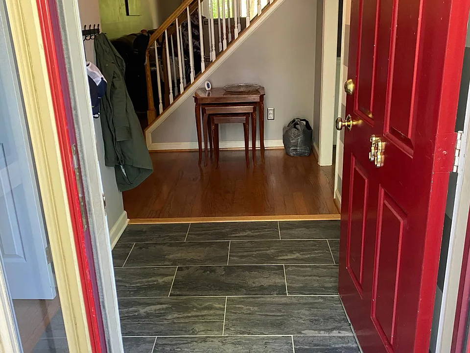 Foyer with new tile floor.