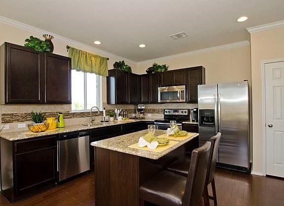 Photo of Model Home with Same Floor Plan, Not of Actual Home Listed