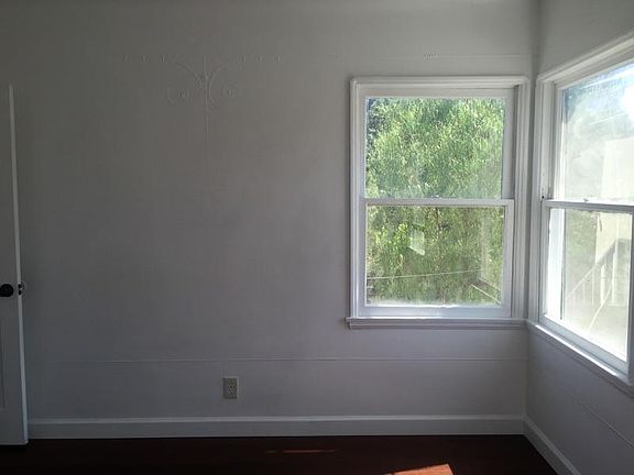 Bedroom with Treetop Views and detailed wall molding