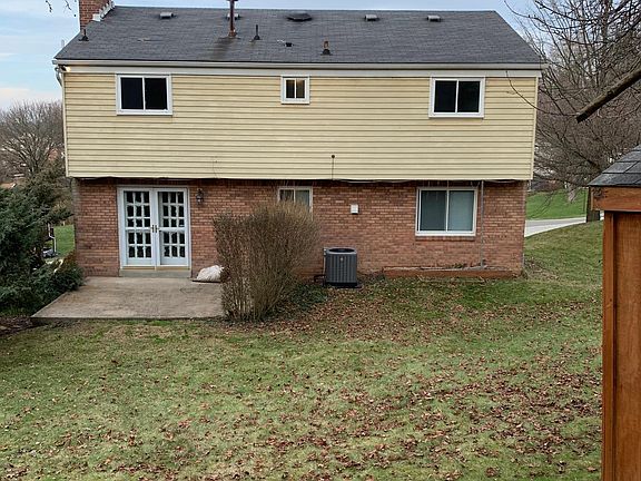 Back of house, porch, backyard. Brand new ac unit just put in.