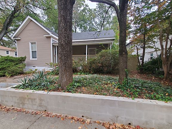 Front porch under the canopy of our beautiful city trees