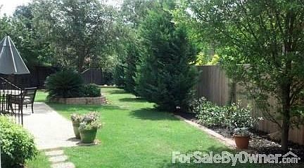 Fenced Back Lawn!
						:
						Private get-a-way retreat in back. Pebbled patio, large trees, landscaped beds.