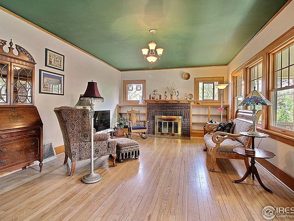 Lots of windows, large living room with beautiful wood floor