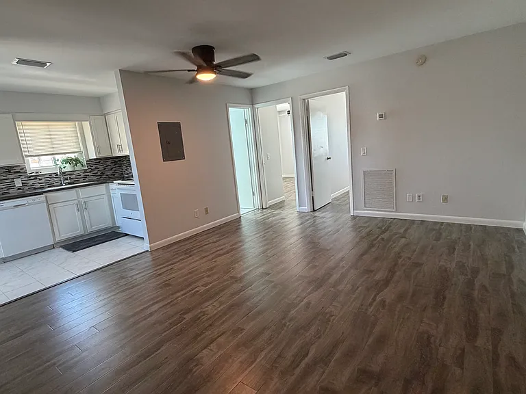 Living room + kitchen view when walking in front door