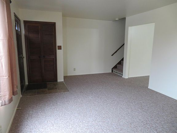 living room with view of stairs
