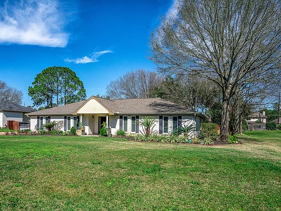 This home has mature trees and lush landscaping offering great curb appeal.