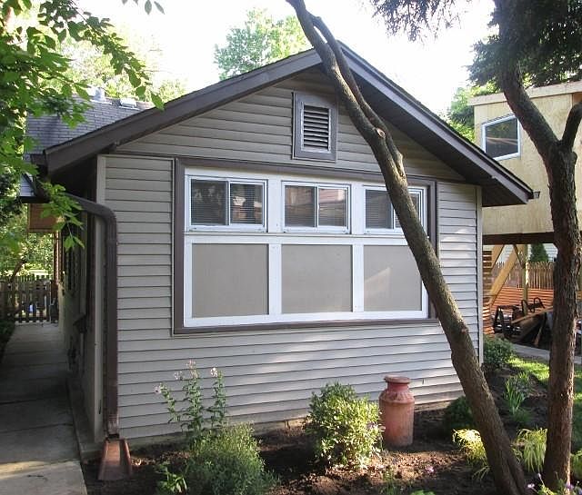 Coach house overlooking landscaped yard