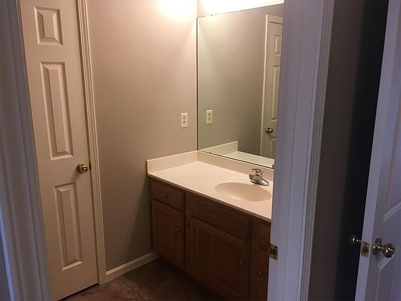 Hall bath, also opens to front bedroom.