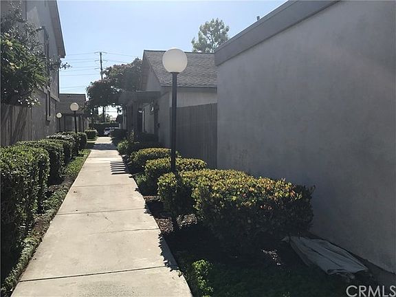 MAIN ENTRANCE AND GARAGE/NORTH OF UNIT/