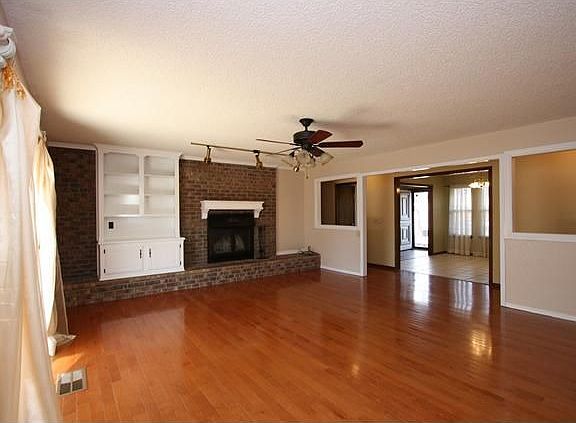 Living Room with Hardwood Floors and Fireplace