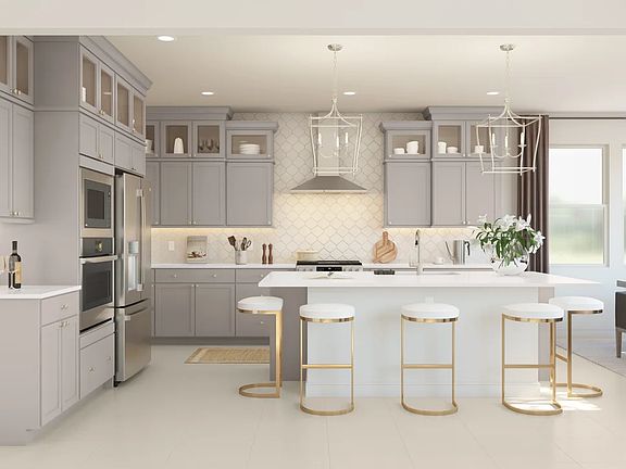 Kitchen with glass upper cabinets and pendant lighting
