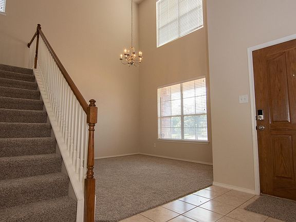 Front door and view of formal dining/living room.
