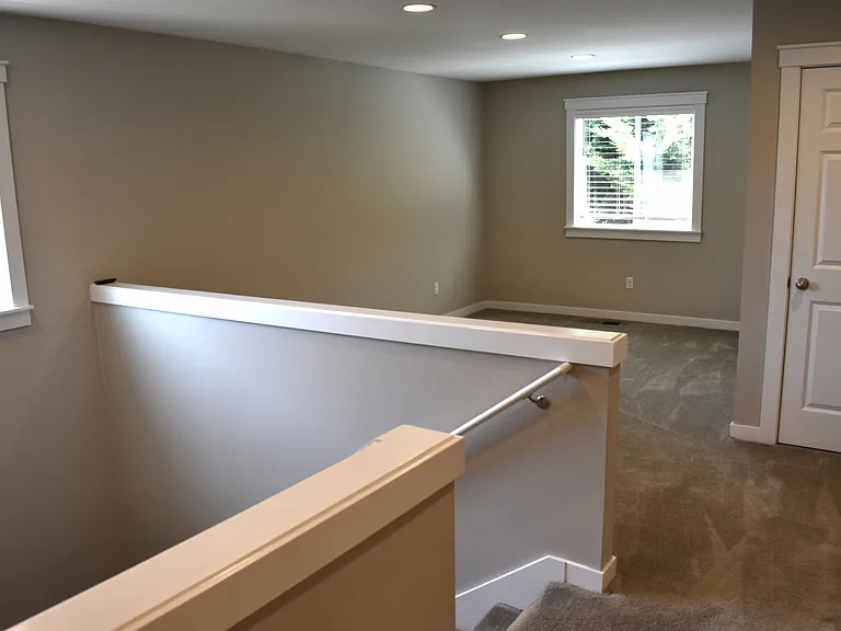 Upstairs to loft area and bedrooms