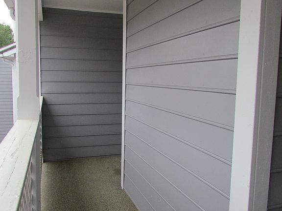 The balcony is accessed through the sunroom.
