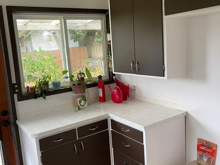 Laundry room features plenty of storage.