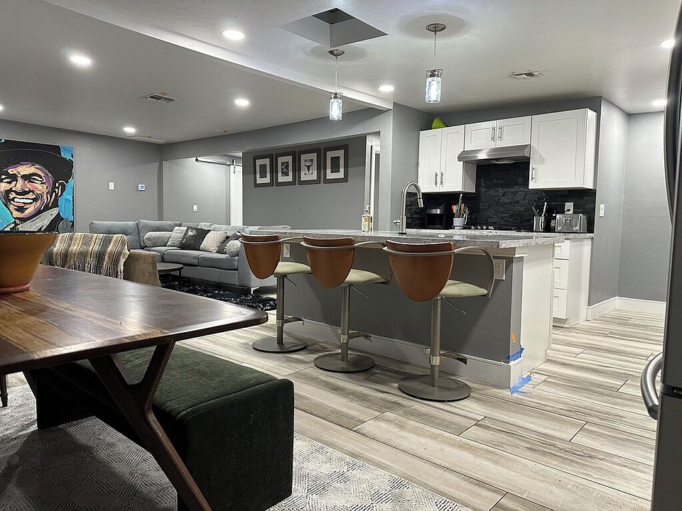 Shared fully stocked kitchen with gas range, large fridge with water dispenser and an eat in kitchen and breakfast island.