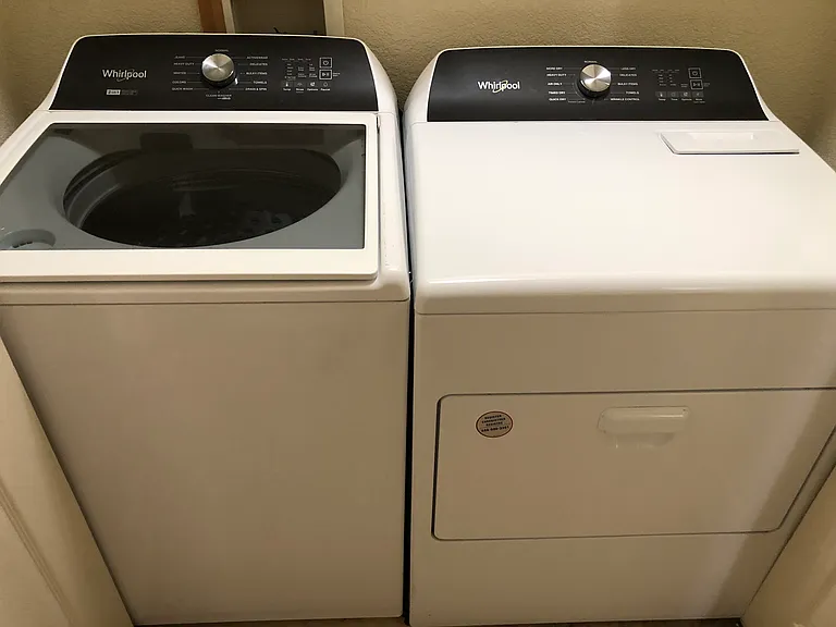 Newer Whirlpool washer and dryer. Washer has removable agitator for larger bulky laundry.