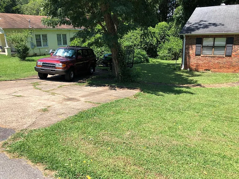 Off Street parking pad meant for two, but can accommodate three.